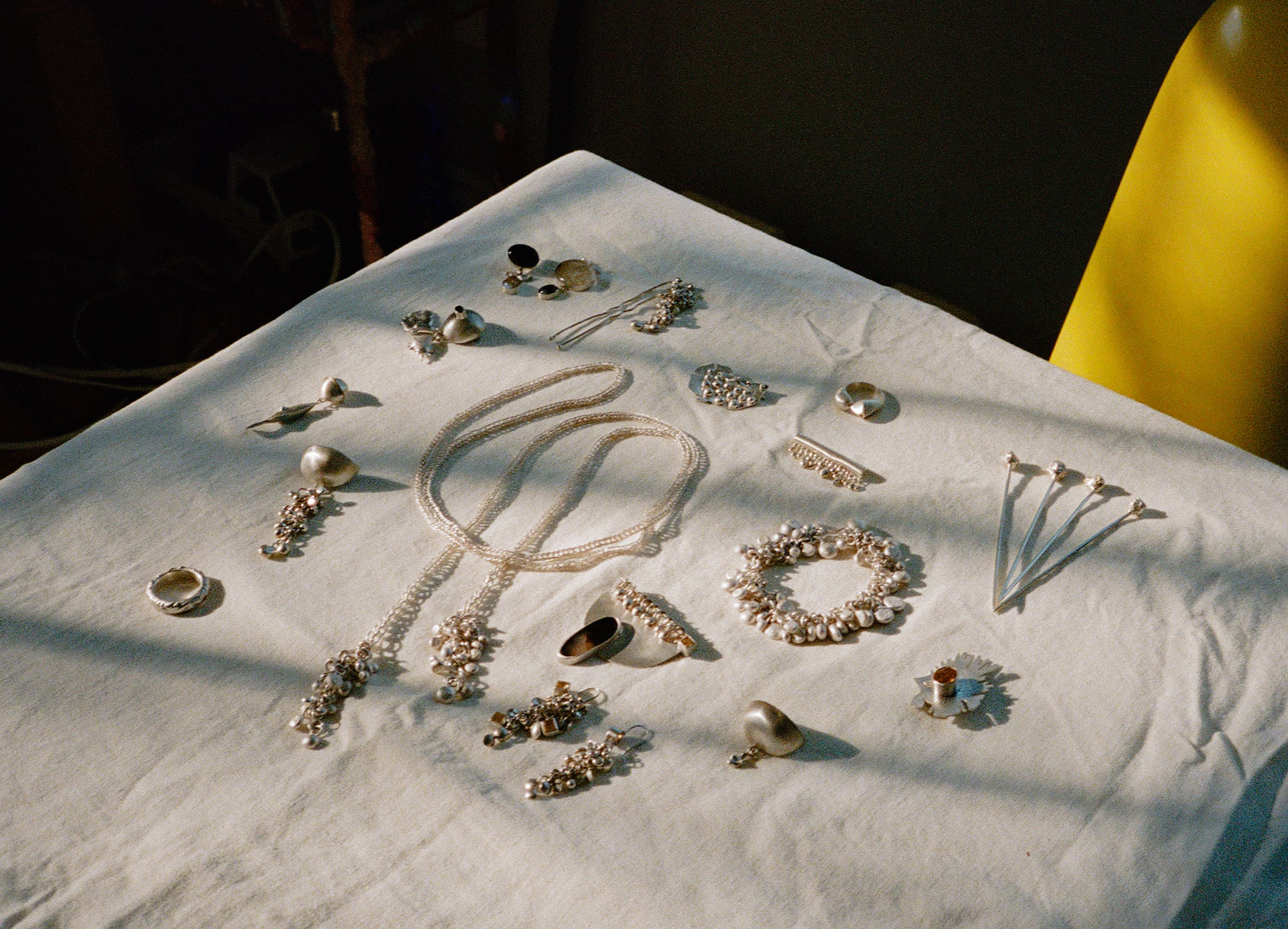 Jewelry arranged on linen fabric